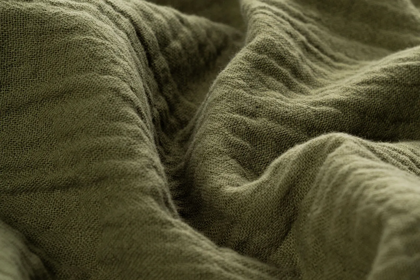 Crinkled olive cotton fabric