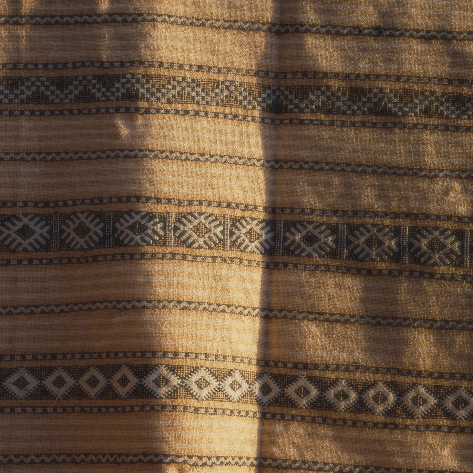 Striped woven cloth in warm light